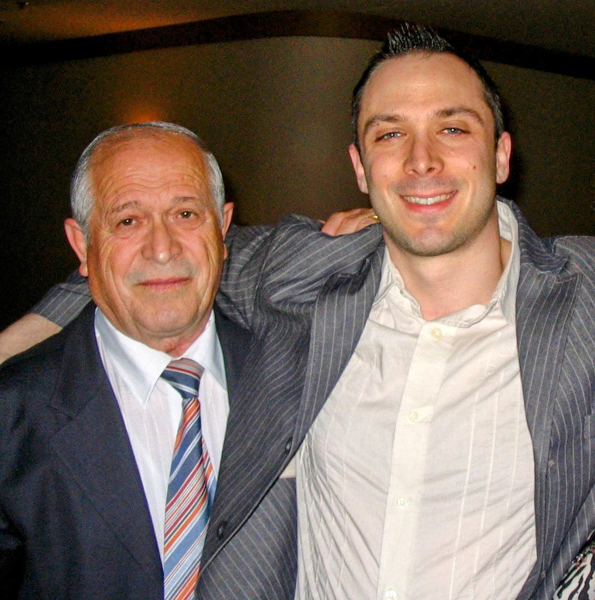 Vincenzo D'Apice and his son Dominic, arms around each other, smiling